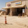 Război imobiliar în Germania: O proprietară a blocat accesul la o farmacie cu mormane de nisip
