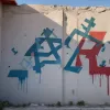 Şcoală din Bad Arolsen vandalizată cu graffiti: Simboluri palestiniene şi sovietice pe pereţi